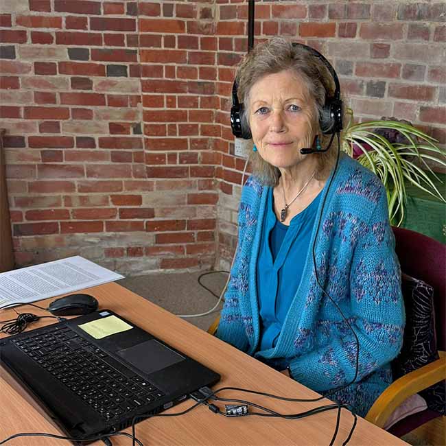 Catherine Keattch sitting in front of a computer