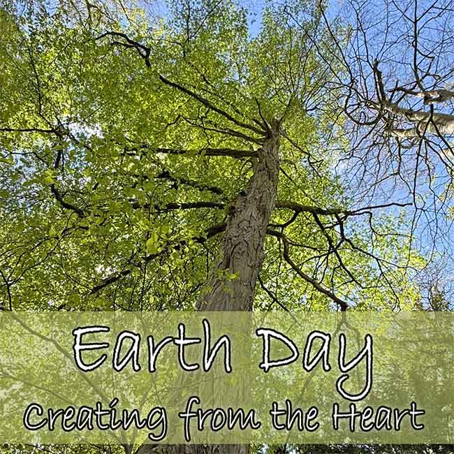 E-Light - A Year of New Beginnings Picture of a beautiful tree looking up into the canopy with Earth Day creating from the Heart text overlaid