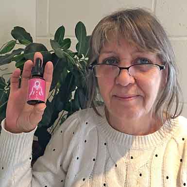 Julia with the Higher Heart Chakra Essence Julia holding the Higher Heart Chakra Essence bottle