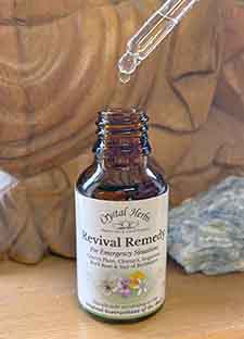 Bottle of Revival Remedy with a dropper pipette being used