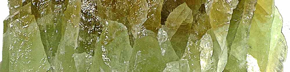 Green Calcite crystal showing the striations and different greens