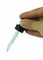 Hand holding a remedy pipette