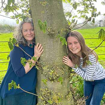 Jackie & Leona tree hugging