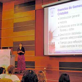 Catherine Keattch on stage presenting the Crystal herbs workshop in Chile - from the side
