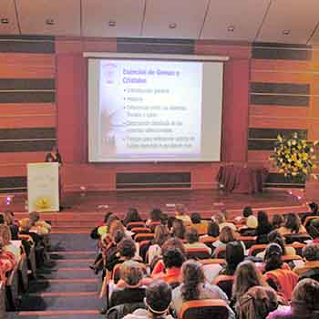 Picture of the conference room with Catherine giving her talk