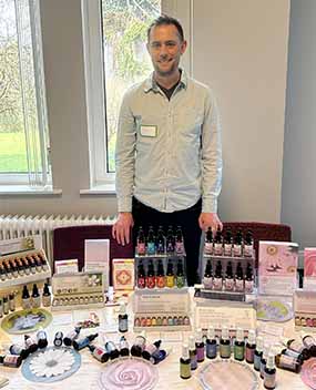 Sam Cremnitz with the Crystal Herbs stand at the BFVEA Gathering 2024