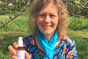 Catherine Keattch holding a flower essence bottle