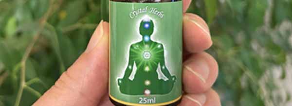 Close up of Crystal Herbs Heart Chakra Essence bottle