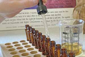 Hand leveling flower essence bottles