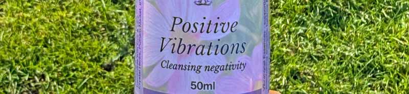 A bottle of Positive Vibrations Essence Spray in nature