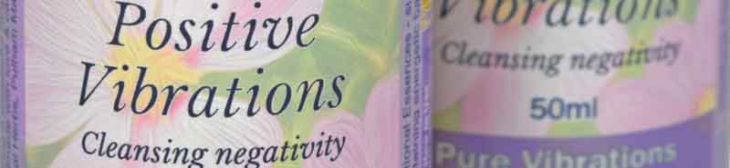 Close up picture of two bottles of Positive Vibrations Essence Sprays