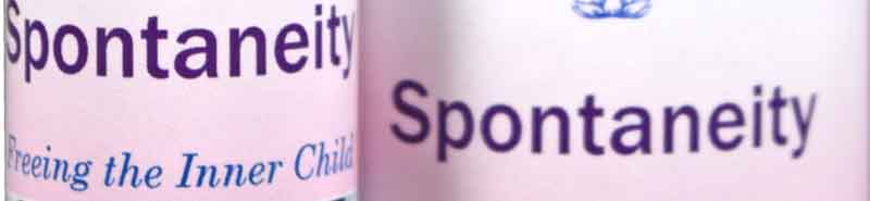 A close up of two bottles of Spontaneity Essence